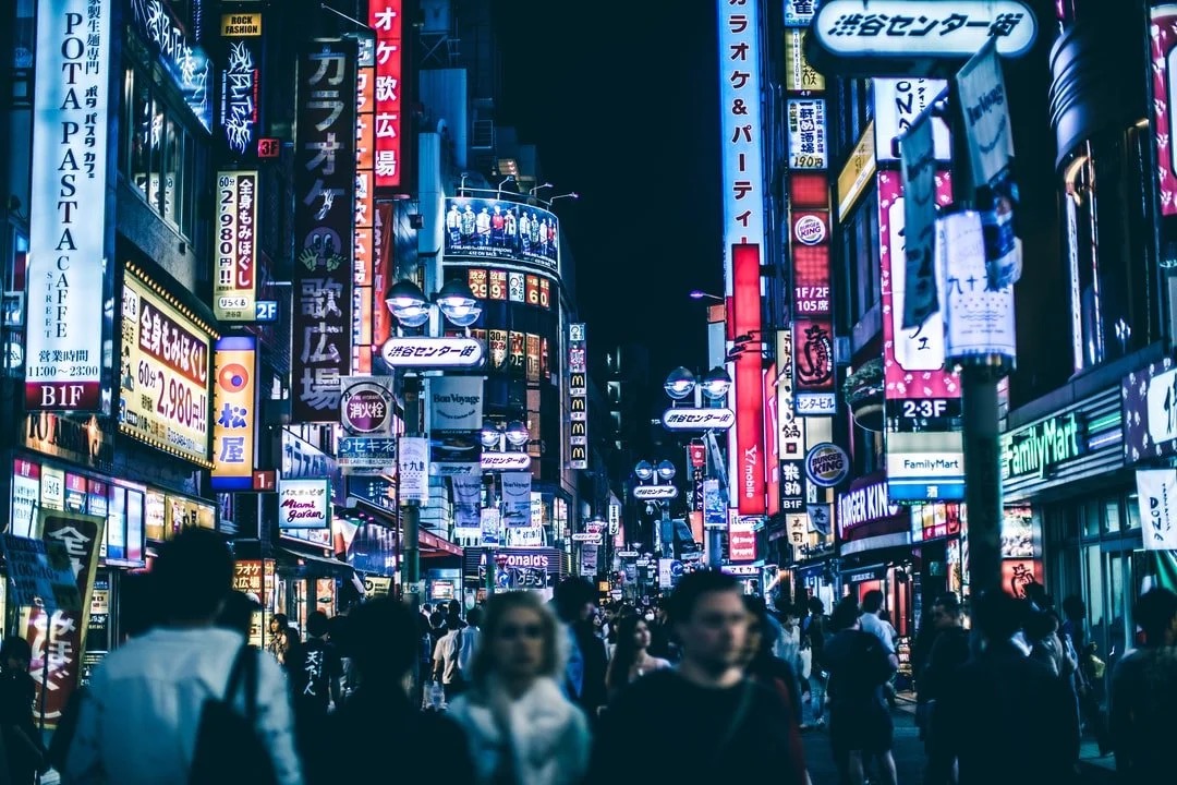 Neon-lit night streets in Tokyo's Shibuya